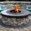 outdoor fire pit with sitting wall and chairs