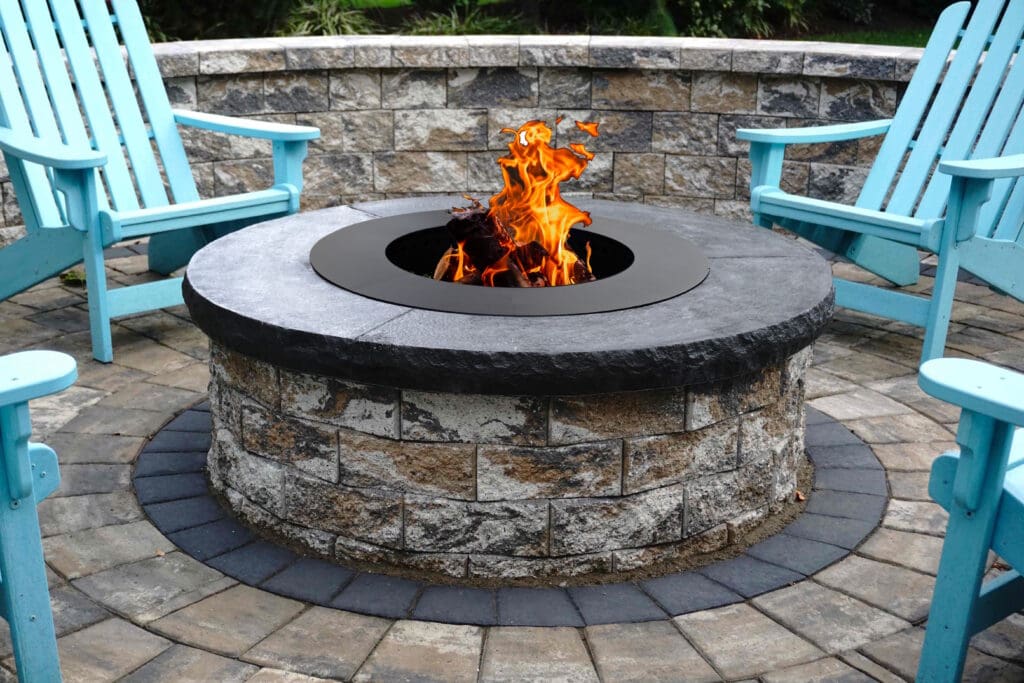 outdoor fire pit with sitting wall and chairs
